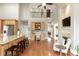 Open kitchen with island seating that flows into office, providing versatile spaces for work and culinary activities at 2675 Portabella Ln, Cumming, GA 30041