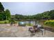 Charming patio with stylish seating, offering picturesque lake views and tranquil outdoor enjoyment at 2675 Portabella Ln, Cumming, GA 30041