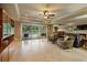 Spacious living room with tile floors, a fireplace, and sliding doors leading to the backyard at 2675 Portabella Ln, Cumming, GA 30041