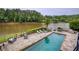 Beautiful pool and stone patio with lake views, perfect for outdoor entertaining at 2675 Portabella Ln, Cumming, GA 30041