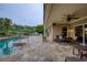 Luxury backyard featuring a pool, stone patio, and outdoor seating area, perfect for entertaining at 2675 Portabella Ln, Cumming, GA 30041