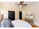 Bedroom design featuring a large bed, artwork, storage cabinet and dark double closet doors at 151 Savannah Se St, Atlanta, GA 30316