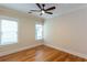 Well-lit bedroom with hardwood floors, crown molding, two windows, and a ceiling fan at 151 Savannah Se St, Atlanta, GA 30316