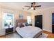 Comfortable bedroom showcasing a cozy bed, dark closet doors, and a neutral color scheme at 151 Savannah Se St, Atlanta, GA 30316