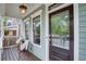 Close-up showcasing the inviting front porch with seating and stylish details at 151 Savannah Se St, Atlanta, GA 30316