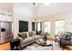 Spacious living room featuring modern decor, hardwood floors, and high ceilings at 151 Savannah Se St, Atlanta, GA 30316