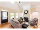 Bright living room with large windows, fireplace, and hardwood floors at 151 Savannah Se St, Atlanta, GA 30316