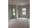 A spacious bedroom featuring two windows and ample natural light at 3108 Marbella Cir # 4, Kennesaw, GA 30152