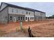 New townhomes under construction featuring brick exteriors, multiple windows, and modern architectural details at 3108 Marbella Cir # 4, Kennesaw, GA 30152