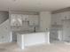 Bright kitchen featuring an island with a sink, sleek white cabinets, and modern fixtures ready for customization at 3108 Marbella Cir # 4, Kennesaw, GA 30152
