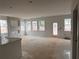 Open concept living room with windows and light, with access to the kitchen, and with a fireplace at 3108 Marbella Cir # 4, Kennesaw, GA 30152