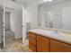 Spacious bathroom vanity with multiple rooms and neutral toned tile flooring at 3430 Grand Manor Trl, Snellville, GA 30039