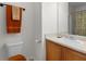 Clean bathroom featuring a toilet, vanity with sink, and a mirror at 3430 Grand Manor Trl, Snellville, GA 30039
