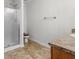 Bathroom with glass shower door, neutral tile, and light countertop vanity at 3430 Grand Manor Trl, Snellville, GA 30039