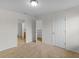 Neutral bedroom with open door, neutral carpet and white trim at 3430 Grand Manor Trl, Snellville, GA 30039