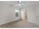 Bedroom with a window, carpet, ceiling fan, and view of ensuite bathroom at 3430 Grand Manor Trl, Snellville, GA 30039