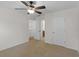 Bedroom with ceiling fan, neutral carpet and a view into the bathroom at 3430 Grand Manor Trl, Snellville, GA 30039