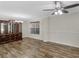 Dining room featuring wood-look floors, a china cabinet, and a modern chandelier at 3430 Grand Manor Trl, Snellville, GA 30039