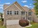 Charming two-story brick home with a well-manicured front yard and attached garage at 3430 Grand Manor Trl, Snellville, GA 30039