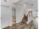 Hallway features wood-look floors, neutral paint, and access to other areas of the home at 3430 Grand Manor Trl, Snellville, GA 30039