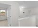 Hallway featuring white trim, with view into the bedroom at 3430 Grand Manor Trl, Snellville, GA 30039