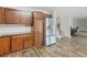Kitchen featuring stainless steel refrigerator and views to staircase at 3430 Grand Manor Trl, Snellville, GA 30039