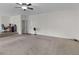 Carpeted living area with an office space and stairs leading to another level at 3430 Grand Manor Trl, Snellville, GA 30039
