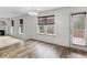 Bright living area with wood floors, fireplace, access to the deck at 3430 Grand Manor Trl, Snellville, GA 30039