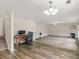 Open-concept living area with fireplace, office space and plush carpeting at 3430 Grand Manor Trl, Snellville, GA 30039