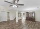 Open-concept living area features wood-look floors and neutral paint throughout at 3430 Grand Manor Trl, Snellville, GA 30039