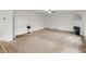 Spacious living room featuring plush carpet and a cozy fireplace at 3430 Grand Manor Trl, Snellville, GA 30039