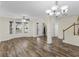 Open-concept living area features wood-look floors, a ceiling fan, and neutral paint at 3430 Grand Manor Trl, Snellville, GA 30039