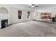 Spacious living area with kitchen, office, and fireplace at 3430 Grand Manor Trl, Snellville, GA 30039