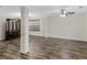 Spacious living room featuring wood-look floors, a china cabinet, and neutral paint at 3430 Grand Manor Trl, Snellville, GA 30039