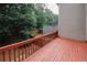 Relaxing outdoor deck area surrounded by greenery and a partial view of the backyard at 3697 E Bay St, Duluth, GA 30096
