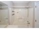 Bright bathroom featuring a shower-tub combination and a sink at 3697 E Bay St, Duluth, GA 30096