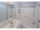 Well-lit bathroom featuring a sink, shower-tub combination, and neutral walls at 3697 E Bay St, Duluth, GA 30096