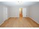 Spacious bedroom featuring hardwood floors, neutral paint, and white trim throughout at 3697 E Bay St, Duluth, GA 30096