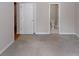 Bedroom featuring neutral colors, carpeted floor and view to ensuite bathroom at 3697 E Bay St, Duluth, GA 30096
