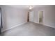 Bedroom featuring neutral colors, carpeted floor, ceiling fan, and ensuite bathroom at 3697 E Bay St, Duluth, GA 30096