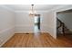Traditional dining room with wainscoting, modern chandelier, and wood floors at 3697 E Bay St, Duluth, GA 30096