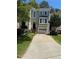 Charming townhome with a two-car garage, complemented by beautiful landscaping and a welcoming entrance at 3697 E Bay St, Duluth, GA 30096