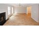 Spacious living room featuring a fireplace, new floors, and abundant natural light at 3697 E Bay St, Duluth, GA 30096