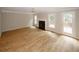 Inviting living room with fireplace, new floors, and access to the outdoor deck at 3697 E Bay St, Duluth, GA 30096