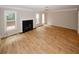 Bright living room features sleek wood floors, a cozy fireplace, and ample windows, providing natural light at 3697 E Bay St, Duluth, GA 30096