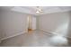 Spacious main bedroom featuring neutral walls, ceiling fan, and ensuite access at 3697 E Bay St, Duluth, GA 30096