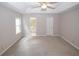Spacious main bedroom with tray ceiling, ceiling fan, and access to the ensuite bathroom at 3697 E Bay St, Duluth, GA 30096