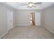 Spacious main bedroom featuring neutral walls, ceiling fan, and ensuite access at 3697 E Bay St, Duluth, GA 30096