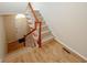 Welcoming interior showcasing a staircase with wood and white accents, leading to an arched doorway at 3697 E Bay St, Duluth, GA 30096