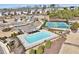 Aerial view of community amenities including a pool, tennis court, clubhouse, and playground at 4090 Danbury Farms Dr, Cumming, GA 30040